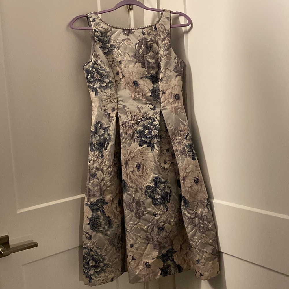 I am selling a pearl grey blue dress size 2
